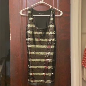 Gently used vegan leather striped sequin tank.